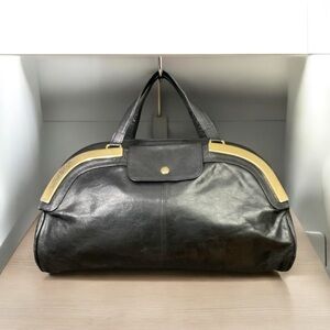 Vintage Pansy leather handbag with gold accents front pocket and zipper